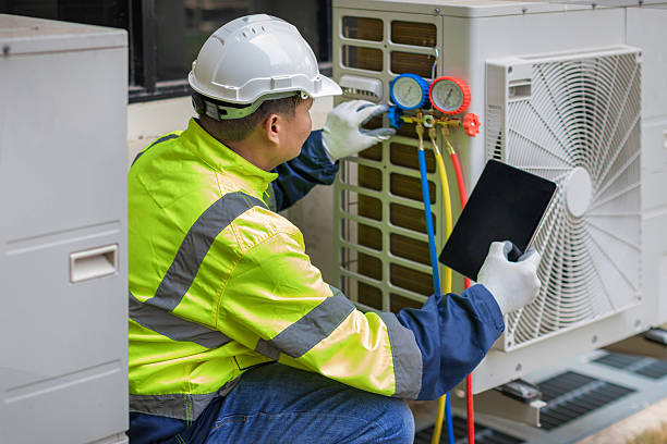 Professional Heat Pump Repair technician working in Livingston, TX